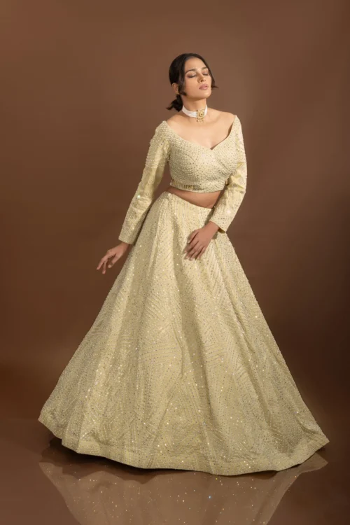 Royal Weaves: Lavish Beige Silk Designer Lehenga Choli With Pearls And Mirrors